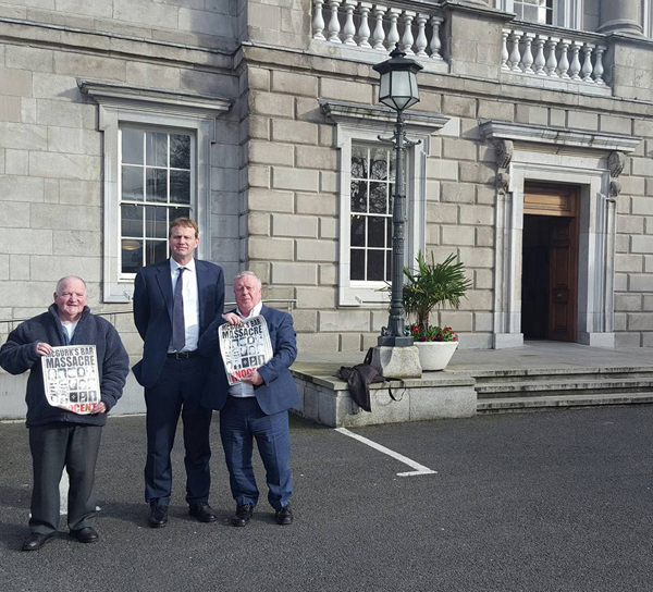 Justice and Equality Spokesperson, Jim O'Callaghan (centre), meets with McGurk's Bar family members, Frank McLaughlin (left) and Robert McClenaghan (right)